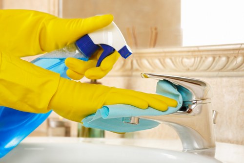 Professional cleaners tidying a KT6 meeting room after office hours