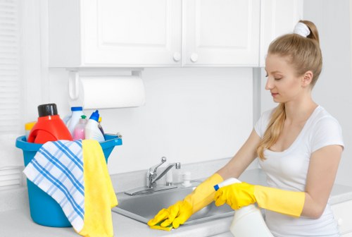 Trained carpet cleaner applying safe cleaning methods in KT6